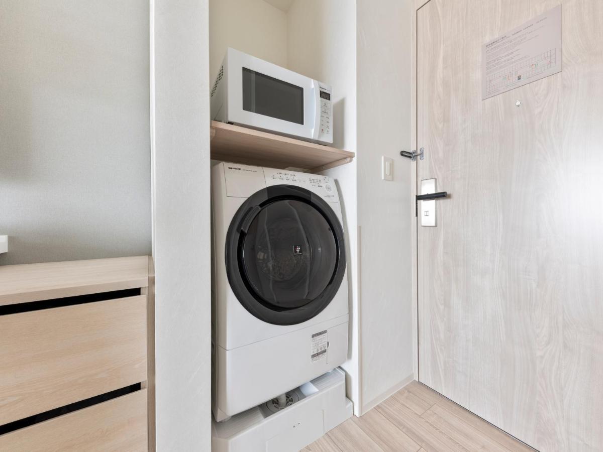 Mitsui Garden Hotel Yokohama Minatomirai Premier المظهر الخارجي الصورة A washing machine and a microwave oven